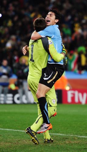 Fernando Muslera en Jorge Fucile