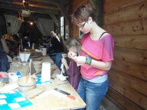 Helping my little sister to build a wooden boat